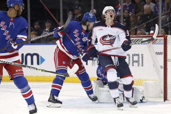 Columbus Blue Jackets center Kent Johnson (91) reacts after missing a shot on goal against the New York Rangers during the second period of an NHL hockey game, Sunday, Oct. 23, 2022, in New York. (AP Photo/Noah K. Murray)