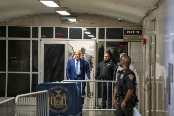 Former President Donald Trump walks outside during the second day of his trial at a Manhattan criminal court, Tuesday, April 16, 2024, in New York. (Mark Peterson/Pool Photo via AP)