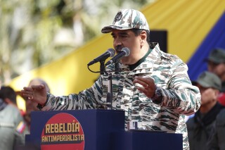 Venezuela's President Nicolas Maduro speaks during a rally marking the 22nd anniversary of the late President Hugo Chavez's return to power after a failed coup attempt, in Caracas, Venezuela, Saturday, April 13, 2024. (AP Photo/Pedro Rances Mattey)