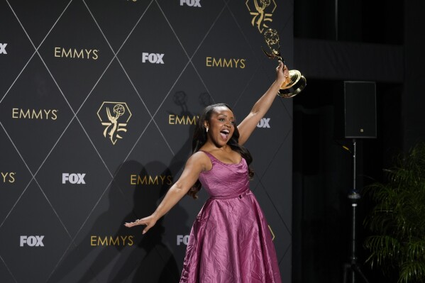 Quinta Brunson, winner of the award for outstanding lead actress in a comedy series for "Abbott Elementary," poses in the press room during the 75th Primetime Emmy Awards on Monday, Jan. 15, 2024, at the Peacock Theater in Los Angeles. (AP Photo/Ashley Landis)