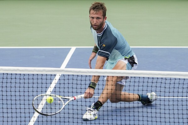 Corentin, Moutet, of France, returns a shot to Andy Murray, of Great Britain, during the first round of the U.S. Open tennis championships, Tuesday, Aug. 29, 2023, in New York. (AP Photo/Mary Altaffer)