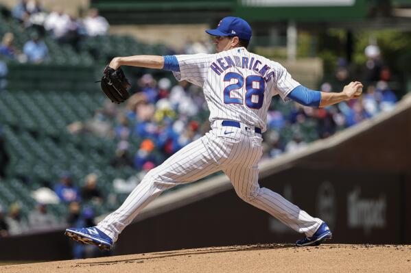 Chicago Cubs starting pitcher Kyle Hendricks (28) throws in the