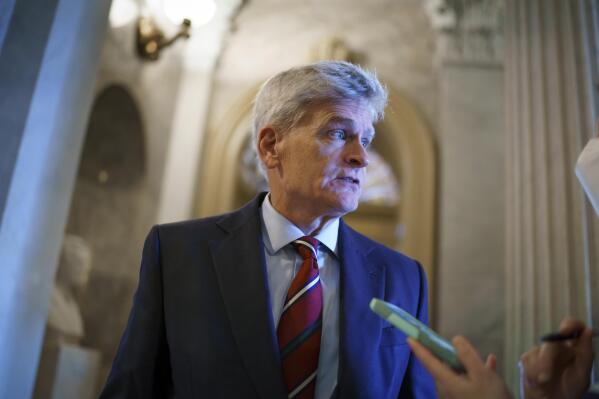 FILE - Sen. Bill Cassidy, R-La., pauses outside the chamber during a confirmation vote, at the Capitol in Washington, Oct. 5, 2021. Both of the state's U.S. senators, Cassidy and Sen. John Kennedy say they have mulled over the option of running for governor and plan on announcing their decisions for 2023. (AP Photo/J. Scott Applewhite, File)