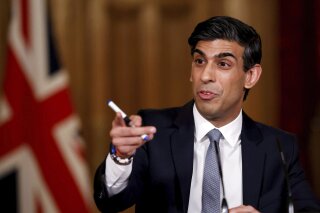 FILE - In this Wednesday, March 3, 2021 file photo, Britain's Chancellor of the Exchequer Rishi Sunak speaks during a press conference following the 2021 Budget, in 10 Downing Street, London. British authorities are exploring the possibility of creating a new digital currency that Treasury chief Rishi Sunak indicated could be known as “Britcoin.” The Bank of England and the Treasury said Monday, April 19, 2021 that they will work together to assess the benefits of a central bank digital currency, at a time when cash payments are generally on the decline, partly as a result of the coronavirus pandemic. (Tolga Akmen/Pool Photo via AP, File)