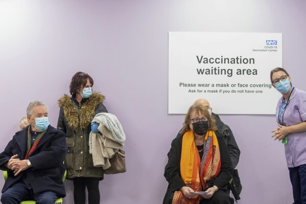 Patients wait to receive a Covid-19 vaccine at the NHS vaccine centre that has been set up at Robertson House in Stevenage, England, Monday Jan. 11, 2021. The centre is one of the seven mass vaccination centres now opened to the general public as the government continues to ramp up the vaccination programme against Covid-19. (Joe Giddens/Pool via AP)