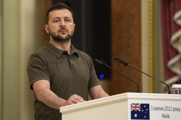 FILE - Ukrainian President Volodymyr Zelenskyy stands at the podium during a joint news conference with Australian Prime Minister Anthony Albanese, in Kyiv, Ukraine, July 3, 2022. (AP Photo/Nariman El-Mofty, File)
