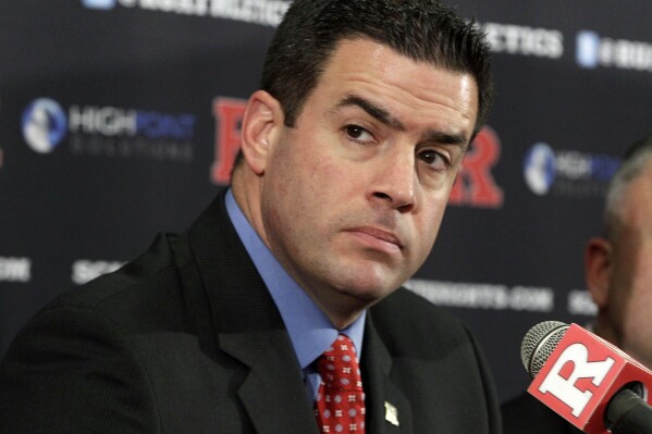 FILE - In this Jan. 31, 2012 file photo, Rutgers Athletic Director Tim Pernetti listens to a question during a news conference in Piscataway, N.J. The American Athletic Conference has hired former Rutgers athletic director Tim Pernetti as its next commissioner to replace the retiring Mike Aresco. (AP Photo/Mel Evans, File)