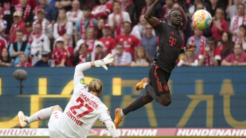 FILE - Bayern's Sadio Mane, right, scores a goal that was disallowed for offside during the German Bundesliga soccer match between 1. FSV Mainz 05 and FC Bayern Munich at the Mewa Arena in Mainz, Germany, Saturday, April 22, 2023. Bayern Munich’s president has confirmed that the club is aware of “initial talks” around a reported move for forward Sadio Mané from the German champion to Saudi Arabian club Al-Nassr. Bayern president Herbert Hainer says the club has been informed about the situation. (AP Photo/Matthias Schrader, File)