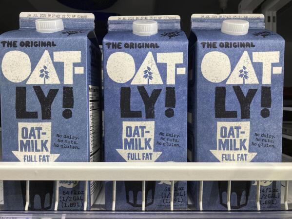 Oatly containers are displayed at a grocery store, Tuesday, May 18, 2021, in North Miami, Fla. Oatly, the world’s largest oat milk company, will raise $1.4 billion in an initial public offering Thursday, May 20 on the Nasdaq stock exchange. (AP Photo/Marta Lavandier)
