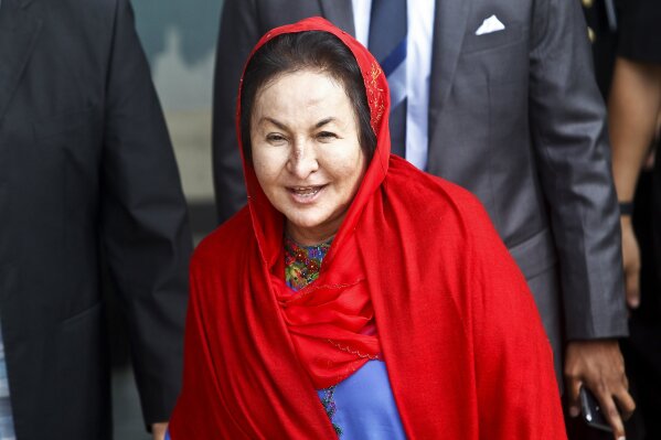 
              Rosmah Mansor, the wife of former Malaysian Prime Minister Najib Razak, leaves the Malaysian Anti-Corruption Commission (MACC) Office in Putrajaya, Malaysia, Tuesday, June 5, 2018. Rosmah was questioned Tuesday by the anti-graft agency over alleged theft and money-laundering involving the 1MDB state investment fund, as Najib's lawyers said they had pulled out. (AP Photo/Sadiq Asyraf)
            