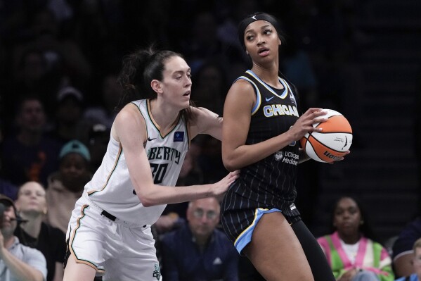 New York Liberty's Breanna Stewart (30) defends against Chicago Sky's Angel Reese (5) during the first half of a WNBA basketball game Thursday, May 23, 2024, in New York. (AP Photo/Frank Franklin II)