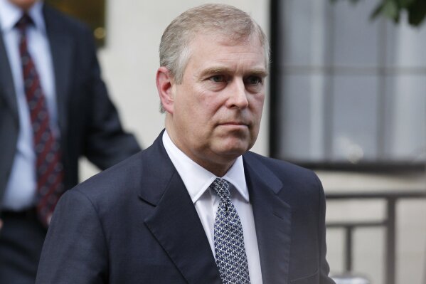 FILE - In this Wednesday, June 6, 2012 file photo, Britain's Prince Andrew leaves King Edward VII hospital in London after visiting his father Prince Philip. The woman who says she was a trafficking victim made to have sex with Prince Andrew when she was 17 is asking the British public to support her quest for justice. Virginia Roberts Giuffre tells BBC Panorama in an interview to be broadcast Monday, Dec. 2, 2019 evening that people “should not accept this as being OK.” (AP Photo/Sang Tan, file)