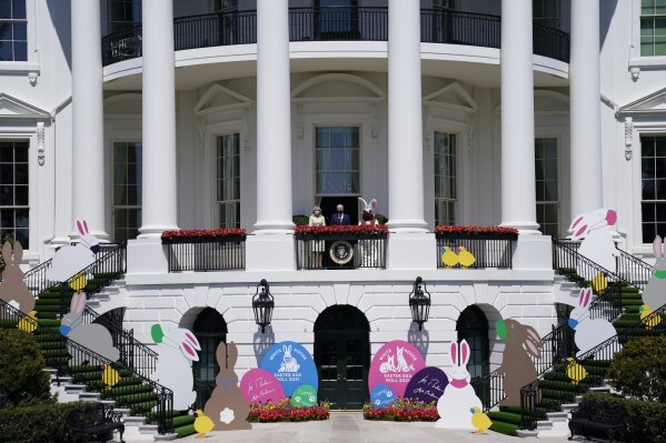 President Joe Biden appears with first lady Jill Biden and the Easter Bunny on the Blue Room balcony at the White House, Monday, April 5, 2021, in Washington. The annual Easter egg Roll at the White House was canceled due to the ongoing pandemic. (AP Photo/Evan Vucci)