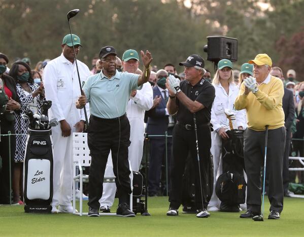 Honorary starter Lee Elder, left, is applauded by fellow honorary starters Gary Player, center, and Jack Nicklaus during introductions for the ceremonial tee shots to begin the Masters golf tournament at Augusta National Golf Club in Augusta, Ga., Thursday, April 8, 2021. Lee Elder, who broke down racial barriers as the first Black golfer to play in the Masters and paved the way for Tiger Woods and others to follow, has died at the age of 87. The PGA Tour announced Elder’s death, which was first reported Monday by Debert Cook of African American Golfers Digest. No cause was given, but the tour confirmed Elder's death with his family. (Curtis Compton /Atlanta Journal-Constitution via AP)
