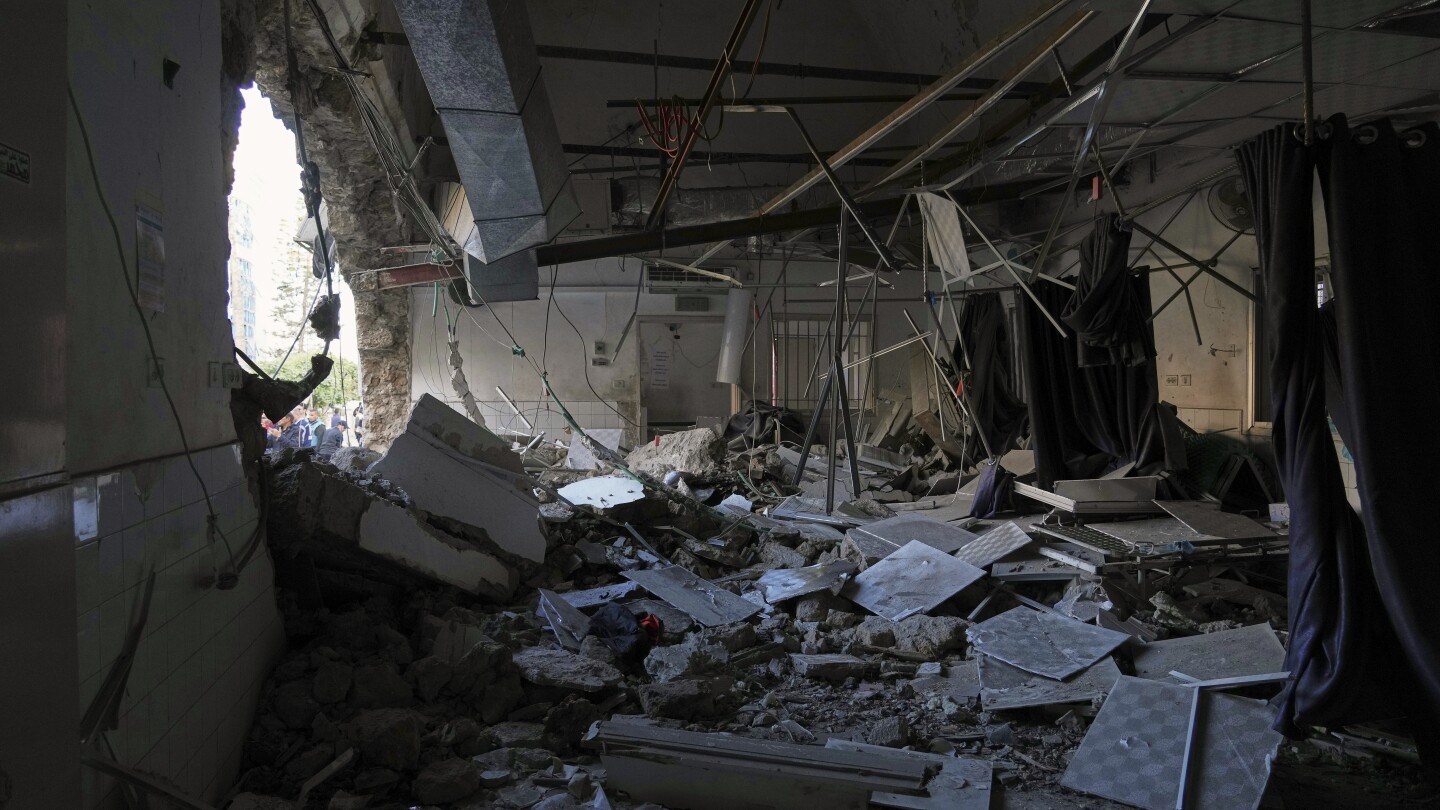 Israel strikes a hospital in Gaza, forcing evacuation as attacks intensify