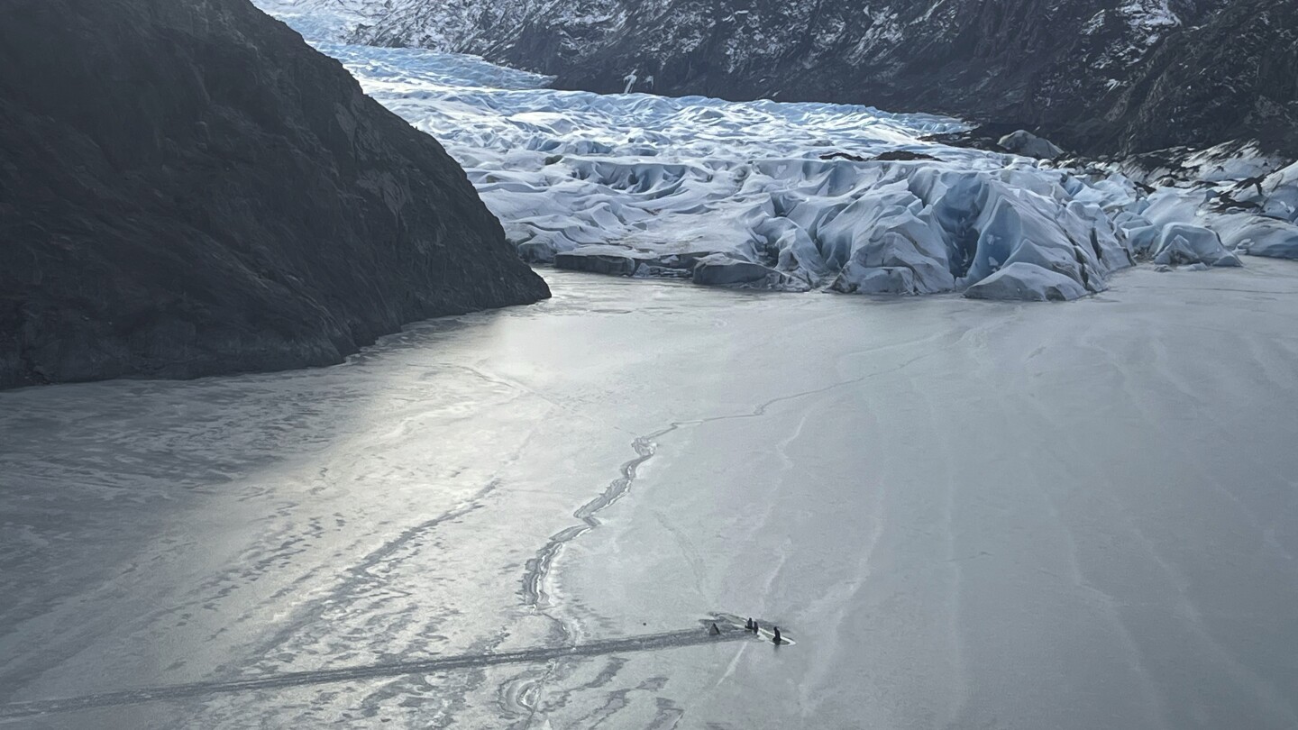 Pilot, 2 children survive night on airplane's wing after it crashes into icy Alaska lake