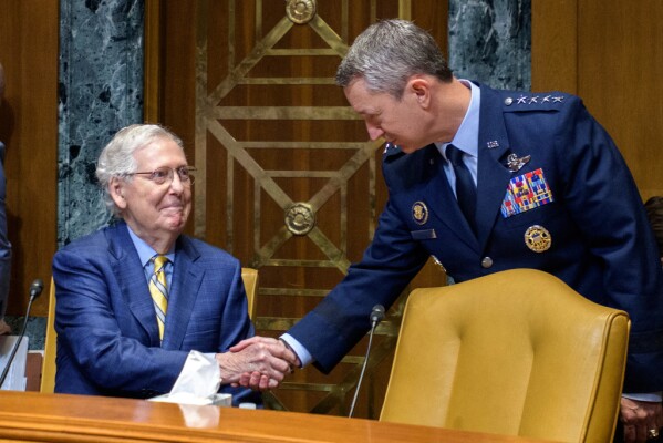 Subcommittee Chairman Sen. Mitch McConnell, R-Ky., left, talks with Gen. John D. Caine, chairman of the Joint Chiefs of Staff, right, prior to a Senate Committee on Appropriations subcommittee hearing to examine proposed budget estimates for fiscal year 2026 for the Department of Defense, on Capitol Hill, Wednesday, June 11, 2025, in Washington. (AP Photo/Rod Lamkey, Jr.)