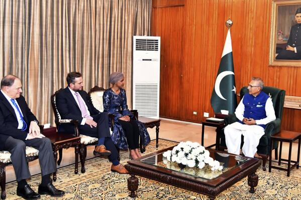 In this photo released by Press Information Department, U.S. Rep. Ilhan Omar, third left, listens to Pakistan's President Arif Ali, right, during their meeting in Islamabad, Pakistan, Wednesday, April 20, 2022. Omar is on the first visit by a member of Congress since a new coalition government came into power in Islamabad last week after the ouster of former premier Imran Khan. (Press Information Department via AP)