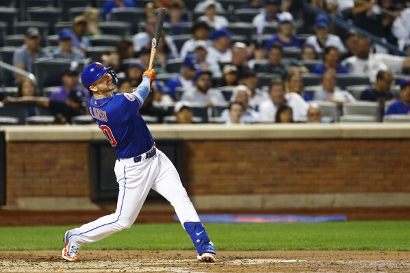 New York Mets' Pete Alonso (20) hits a two-run home run against the Chicago Cubs during the third inning of a baseball game, Monday, Aug. 7, 2023, in New York. (AP Photo/Rich Schultz)