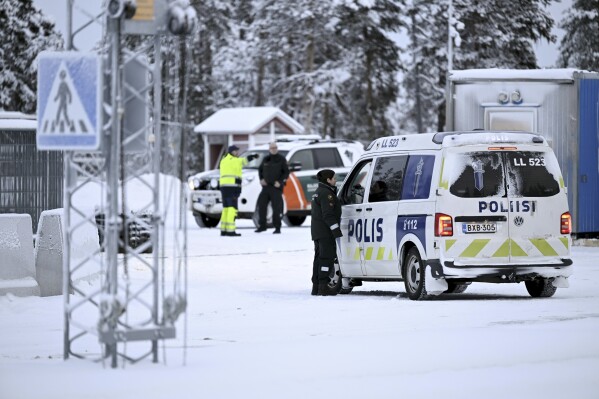 Finnish border guards and police at the Radja Joseppi border crossing in Inari, northern Finland, Friday, November 24, 2023. On Wednesday, Finnish border guards and soldiers began constructing barriers, including concrete obstacles partially lined with barbed wire. A crossroads on the long border between the Nordic country and Russia.  (Emmi Korhonen./Lehtikuva, via AP)