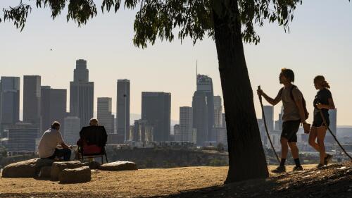 FILE - Albert Maghbouleh, far left, and Miles Santamour, 89, with the Amigos de Jaibalito Foundation (ADJ) have lunch while maintaining social distancing outdoors on January 11, 2021 overlooking the Los Angeles skyline. America has gotten older in the last decade. According to new figures from the 2020 Census released on Thursday, May 25, 2023, the proportion of seniors aged 65 years or older in the United States increased by more than a third, while the proportion of children declined, particularly at the under 5s Photo/Damian Dovarganes, file)
