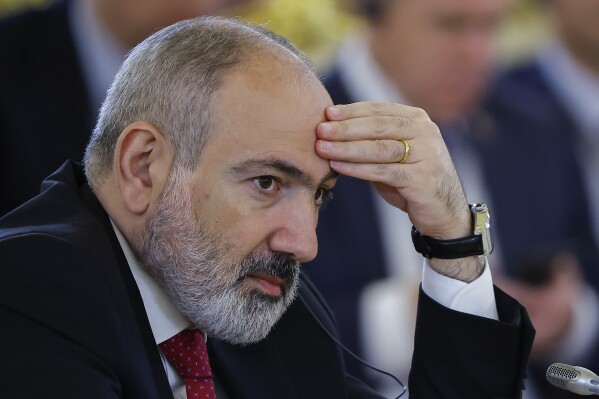 FILE - Armenian Prime Minister Nikol Pashinyan attends a meeting of the Supreme Eurasian Economic Council of the Eurasian Economic Union at the Kremlin in Moscow, Russia, on Wednesday, May 8, 2024. Thousands of protesters gathered Thursday, May 9, 2024, in the Armenian capital, Yerevan, to demand the resignation of Prime Minister Nikol Pashinyan over his government's decision to hand over control of border villages to Armenia's long-time rival Azerbaijan. (Evgenia Novozhenina/Pool Photo via Ǻ, File)