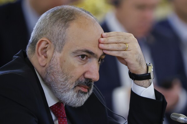 FILE - Armenian Prime Minister Nikol Pashinyan attends a meeting of the Supreme Eurasian Economic Council of the Eurasian Economic Union at the Kremlin in Moscow, Russia, on Wednesday, May 8, 2024. Thousands of protesters gathered Thursday, May 9, 2024, in the Armenian capital, Yerevan, to demand the resignation of Prime Minister Nikol Pashinyan over his government's decision to hand over control of border villages to Armenia's long-time rival Azerbaijan. (Evgenia Novozhenina/Pool Photo via AP, File)