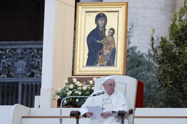 FILE - Pope Francis, sitting in front of a replica of the icon 'Maria Salus populi romani'', addresses the participants into 