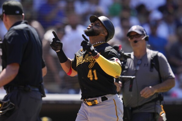 Pittsburgh Pirates' Carlos Santana (41) celebrates after hitting a home run during the ninth inning of a baseball game against the San Diego Padres, Wednesday, July 26, 2023, in San Diego. (AP Photo/Gregory Bull)