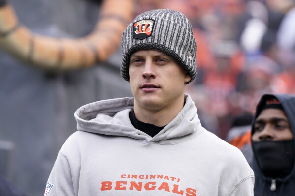 Cincinnati Bengals quarterback Joe Burrow (9) stands on the sidelines during the first half of an NFL football game against the Pittsburgh Steelers in Cincinnati, Sunday, Nov. 26, 2023. (AP Photo/Jeffrey Dean)