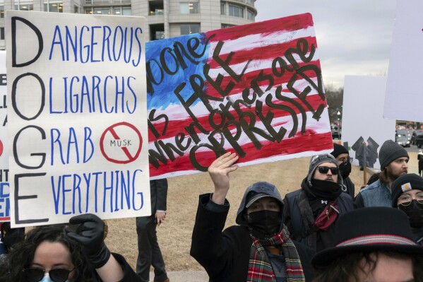 People protest during a rally outside the U.S. Department of Labor in Washington, Feb. 5, 2025. (AP Photo/Jose Luis Magana, File)