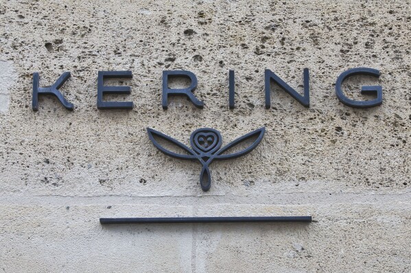 FILE - The logo of French luxury group Kering is pictured in Paris, France, on Sept. 15, 2017. French luxury conglomerate Kering has reached a cash deal to purchase a 30% stake in Italian fashion house Valentino for 1.7 billion euros from a Qatari investment firm. Under the deal announced Thursday, July 27, 2023, Kering has the option to buy 100% of Valentino no later than 2028. (AP Photo/Michel Euler, File)