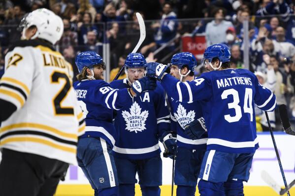 Toronto Maple Leafs celebrate after forward Auston Matthews (34) scored against the Boston Bruins during the second period of an NHL hockey game, Saturday, Nov. 5, 2022 in Toronto. (Christopher Katsarov/The Canadian Press via AP)
