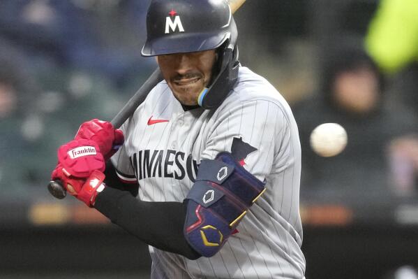 Minnesota Twins' Carlos Correa reacts to an inside pitch from Chicago White Sox's Michael Kopech during the sixth inning of a baseball game on Tuesday, May 2, 2023, in Chicago. (AP Photo/Charles Rex Arbogast)