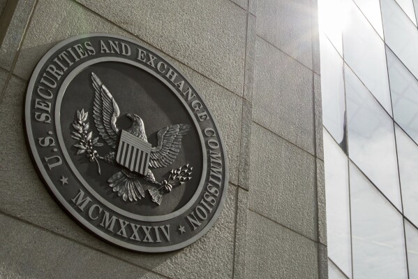 FILE - The seal of the U.S. Securities and Exchange Commission at SEC headquarters, June 19, 2015, in Washington. The cryptocurrency fund manager Grayscale won a major court battle Tuesday, Aug. 29, 2023, when the D.C. Court of Appeals ruled in favor of the company in its lawsuit against the Securities and Exchange Commission that will pave the way for the first bitcoin exchange-traded fund. (AP Photo/Andrew Harnik, File)