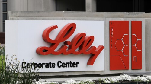 FILE - A sign for Eli Lilly & Co. sits outside their corporate headquarters in Indianapolis on April 26, 2017. New research shows another experimental Alzheimer's drug can modestly slow patients' inevitable worsening. Patients given monthly infusions of Eli Lilly and Co.'s donanemab declined about four to seven months more slowly than those given dummy infusions in a large study. (AP Photo/Darron Cummings, File)