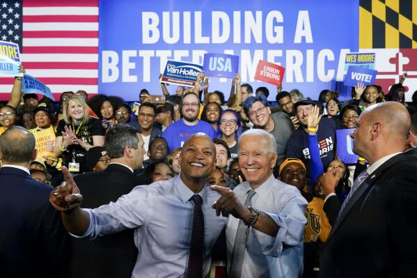 President Joe Biden poses for photos with Maryland Democratic gubernatorial candidate Wes Moore during a campaign rally at Bowie State University in Bowie, Md., Monday, Nov. 7, 2022. (AP Photo/Susan Walsh)