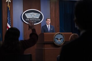 FILE - In this Feb. 17, 2021, file photo, Pentagon spokesman John Kirby speaks during a media briefing at the Pentagon in Washington. A U.S. airstrike targeting facilities used by Iran-backed militias in Syria appears to be a message to Tehran delivered by a new American administration still figuring out its approach to the Middle East. Kirby said the operation in Boukamal, Syria, sends an unambiguous message: “President Biden will act to protect American and coalition personnel. At the same time, we have acted in a deliberate manner that aims to deescalate the overall situation in eastern Syria and Iraq.” (AP Photo/Alex Brandon, File)