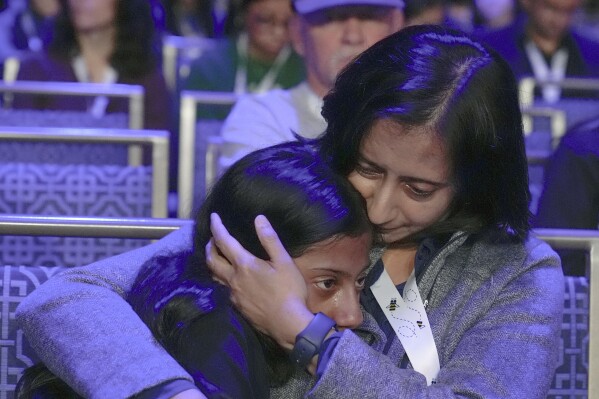 Siya Sampath, 9, left, of Haymarket, Va., reacts with her mother after spelling her word incorrectly during the quarterfinals of the Scripps National Spelling Bee, in Oxon Hill, Md., Wednesday, May 29, 2024. (AP Photo/Mariam Zuhaib)