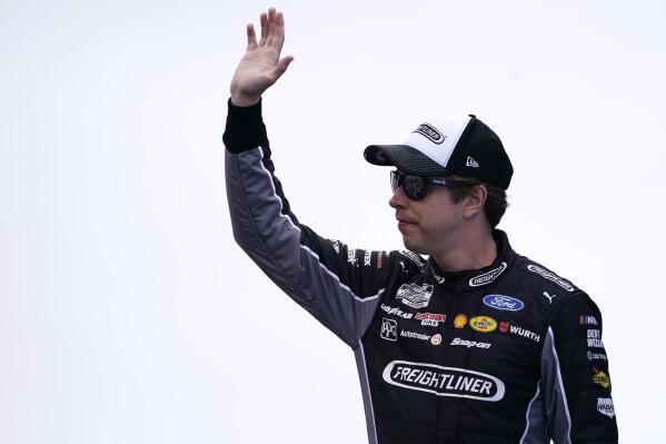 Brad Keselowski waves to fans before the NASCAR Cup Series auto race Sunday, July 18, 2021, in Loudon, N.H. (AP Photo/Charles Krupa)