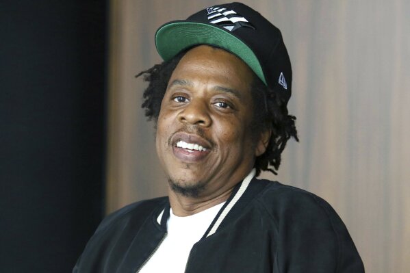FILE - In this July 23, 2019, file photo, Jay-Z makes an announcement of the launch of Dream Chasers record label in joint venture with Roc Nation, at the Roc Nation headquarters in New York. Jay-Z’s Roc Nation entertainment company is partnering with Brooklyn’s Long Island University to launch the Roc Nation School of Music, Sports & Entertainment. The new school will begin enrolling students for the fall 2021 semester, and 25% of the incoming freshmen class will receive Roc Nation Hope Scholarships. (Photo by Greg Allen/Invision/AP, File)