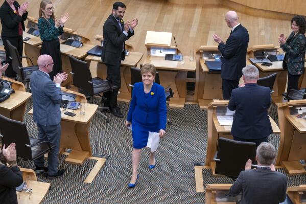 Outgoing Scottish First Minister Nicola Sturgeon leaves the main chamber after her last First Minister's Questions (FMQs) in the main chamber of the Scottish Parliament in Edinburgh, Thursday March 23, 2023. (Jane Barlow/PA via AP)