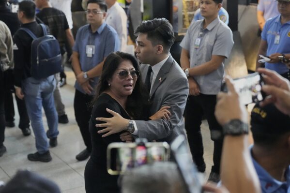 A supporter of former President Rodrigo Duterte reacts upon finding out he was arrested, at the airport in Manila, Philippines, Tuesday, March 11, 2025. (AP Photo/Aaron Favila)
