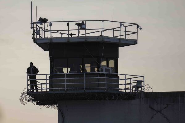 A guard stands in a tower at Indiana State Prison on Tuesday, Dec. 17, 2024, in Michigan City, Ind. (AP Photo/Erin Hooley, File)