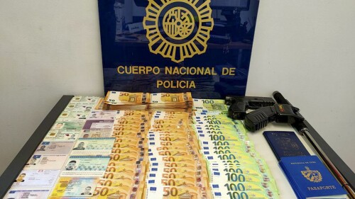 This photo provided by the Serbian Ministry of Interior on Monday July 24, 2023, shows seized money, weapons and documents in a raid. Serbian police said Monday they have arrested two people suspected of helping smuggling Cubans toward Spain as part of an international crime group. The suspects in Serbia are accused of organizing the illegal transfer of at least 53 people to neighboring countries — North Macedonia or Bosnia — and on to Spain. (Serbian Ministry of Interior via AP)