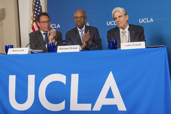 Richard Leib, chair of the Board of Regents, left, and Dr. Michael Drake, president of the University of California, center, introduce Dr. Julio Frenk as the next chancellor of UCLA at a news conference Wednesday, June 12, 2024, on the UCLA campus in Los Angeles. (AP Photo/Damian Dovarganes)
