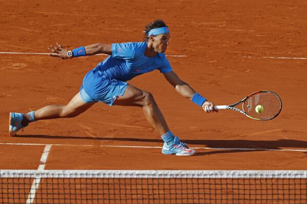 FILE - Spain's Rafael Nadal plays a shot in the fourth round match of the French Open tennis tournament against Jack Sock of the U.S. to win in four sets 6-3, 6-1, 5-7, 6-2, at the Roland Garros stadium, in Paris, France, Monday, June 1, 2015. (AP Photo/Michel Euler, File)