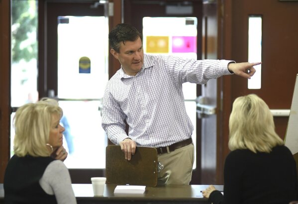 
              Yellowstone County Election Administrator Bret Rutherford briefs election staff at MetraPark in Billings, Mont., Thursday, May 25, 2017. (Larry Mayer /The Billings Gazette via AP)
            
