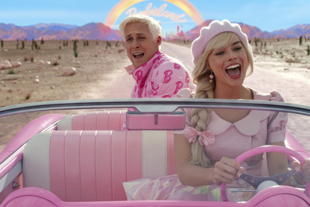 This image released by Warner Bros. Pictures shows Ryan Gosling, left, and Margot Robbie in a scene from "Barbie." (Warner Bros. Pictures via AP)