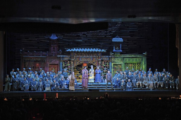 In this photo provided by the Metropolitan Opera, the cast performs during Act 1 of Puccini's “Turandot” on Wednesday, March 20, 2024, at the Metropolitan Opera in New York. The Met was forced to stage a semi-staged performance of the show after a stage elevator jammed. (Karen Almond/Metropolitan Opera via AP)